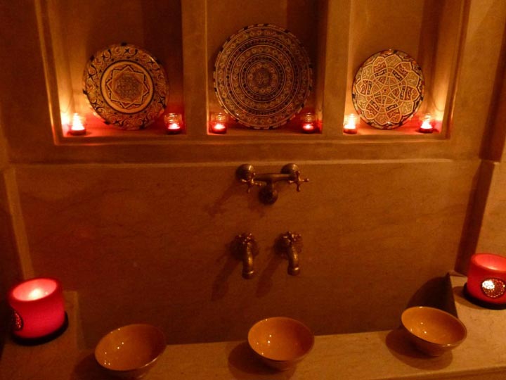 Water bowls in a simple traditional Moroccan hammam
