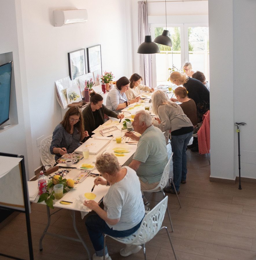 Watercolour retreat group painting together in the villa studio